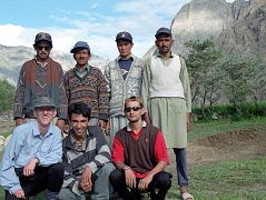 14 Team Photo At Thongol - Jerome Ryan, guide Iqbal, cook Ali, porters Syed, Muhammad Khan, and Muhammad Siddiq, sirdar Ali Naqi We arrive in Thongol and quickly unload the jeep and set up the kitchen tent and my tent where I rest for a few minutes. Ahhh. Iqbal puts together the loads a little bit like a jigsaw puzzle trying to even them out to 25kg each. There are nine loads so Iqbal has to find five more porters. He tells me he's having trouble because the porters want to wait for the mountaineering expedition we met on the flight to Skardu. Here is our team at Thongol: below - Jerome Ryan, guide Iqbal, cook Ali; above - porters Syed, Muhammad Khan, and Muhammad Siddiq, and finally our sirdar Ali Naqi.